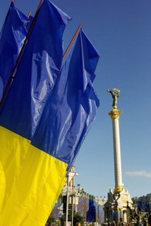 Independence square of capital city Kiev and Ukrainan flag