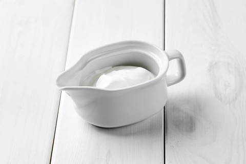 Sour cream in ceramic gravy boat