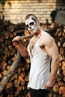 Male daemon with axe near firewood placing. Face painting art