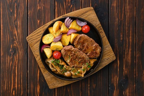 Top view of plate with fried pork fillet