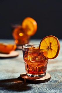 Cocktail old fashioned with hard light and harsh shadows