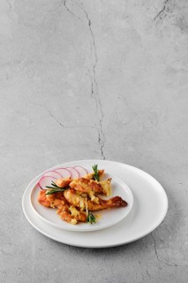 Plate with chicken stripes baked with cheese and onion