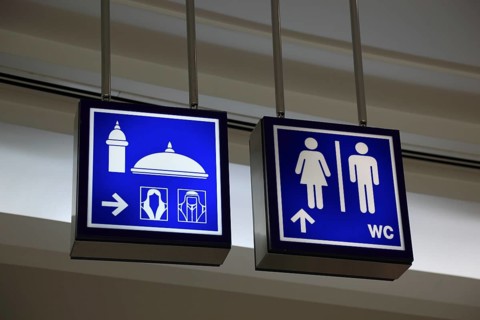 Signs for mosque and toilets in the City Centre Doha