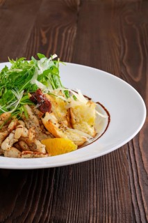 Closeup view of salad with fried chicken meat