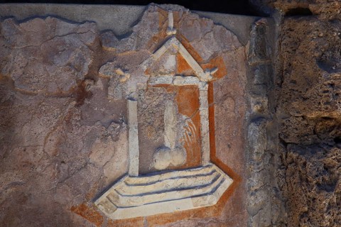 Stone relief of a penis as a reference to the brothel