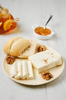 Healthy rustic breakfast. Homemade curd cheese with raisin and walnut