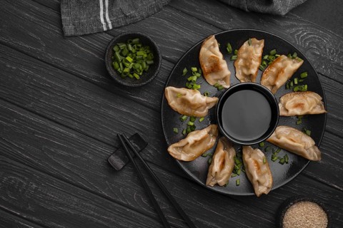 Traditional asian dumplings plate with chopsticks herbs. Resolution and high quality beautiful photo