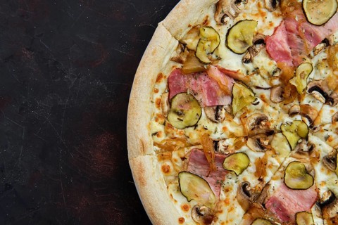 Close up view of pizza with bacon