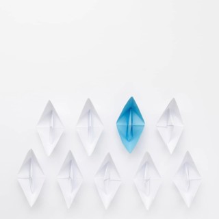 Creative composition individuality concept paper boats
