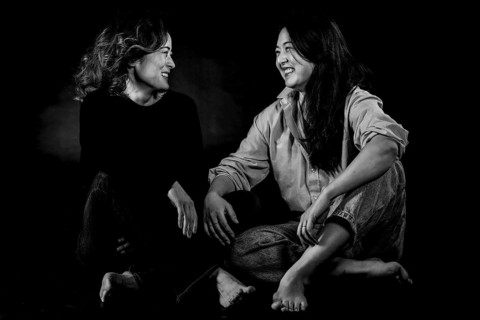 Two Asian woman sitting