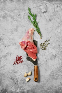 Composition with raw uncooked lamb leg