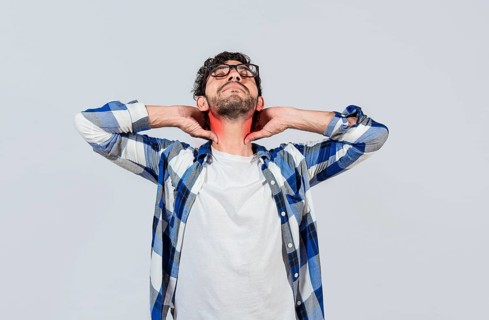 Young man with shoulder and neck problems