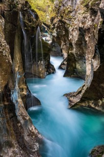 Mountain river Soca flows through narrow canyon