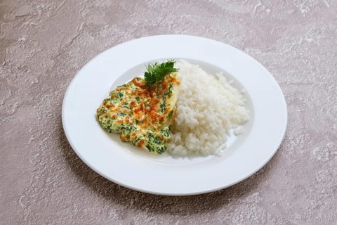 Fried hake fillet with spinach