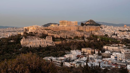 View from Philopappos Hill over the city at sunset