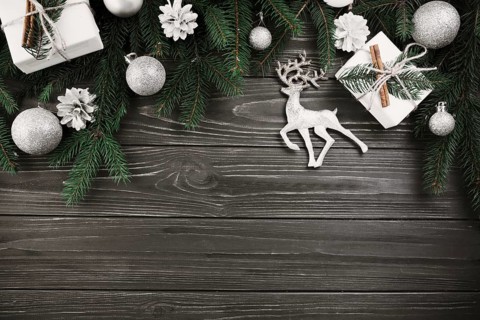 Christmas composition green fir tree branches with small deer