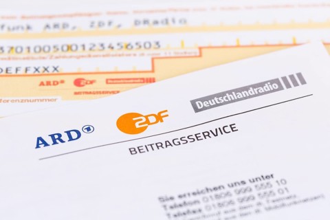 Contribution service of ARD and ZDF Rundfunkgebuehr GEZ with remittance slip in Stuttgart