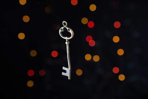 Retro style key on a bokeh light background