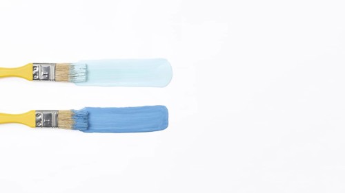 Top view yellow brushes with blue paint. Resolution and high quality beautiful photo