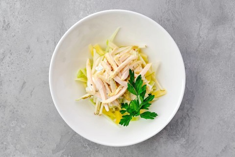 Top view of salad with ham