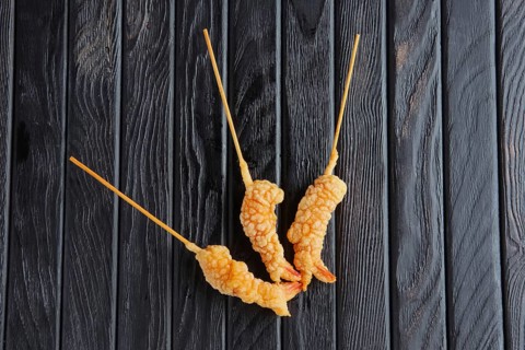 Appetizer for reception. Deep-fried shrimp on skewer