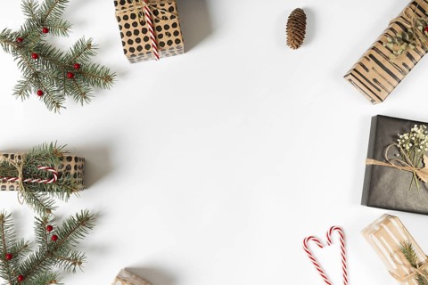 Gift boxes with green branches candy canes
