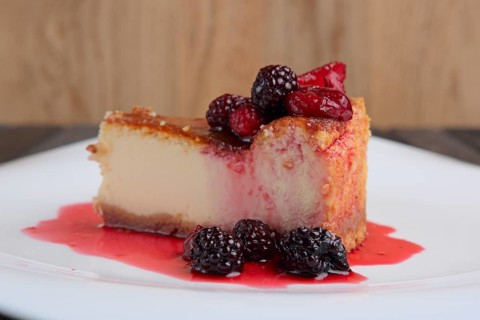 Piece of cheesecake with cherry