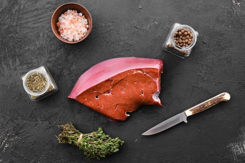 Raw fresh beef liver with spice and herbs