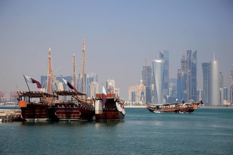 Fishing boats in front of the skyline of Doha