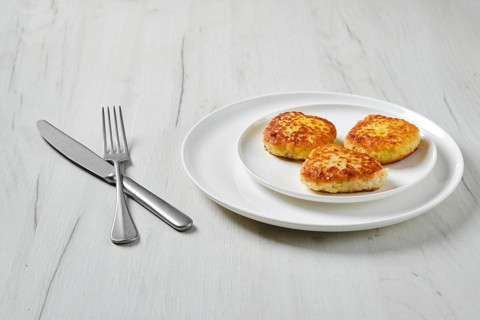 Fried squid cutlet in breading on a plate