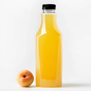 Front view juice glass bottle with peach