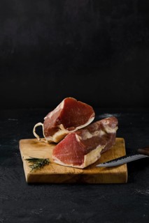 Smoked beef fillet meat on cutting board