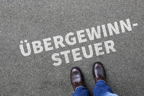 Excess profit tax symbolic image law to Zuffalsgewinn of the federal government as a business concept with businessman in Stuttgart