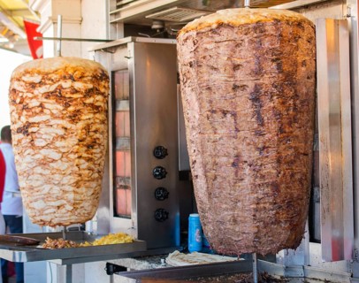 Traditional Turkish food Doner Kebab. Turnspit skewing kebap kebab shawarma