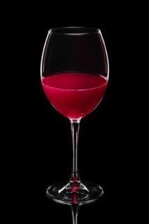 Glass of white wine isolated on black