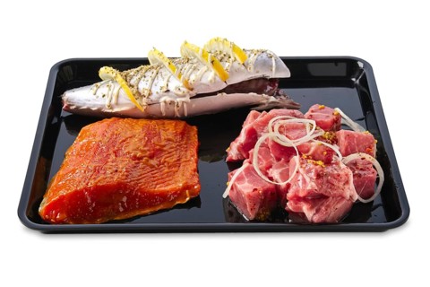 Marinated varieties of meat and fish ready for grilling isolated on white background