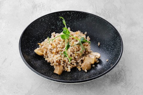 Boilet pearl barley with fried mushrooms