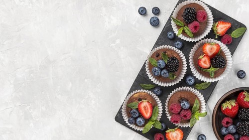 Flat lay tasty muffin with forest fruit