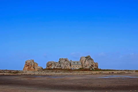 Country house between rocks near Le Gouffre