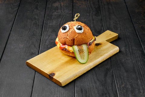 Hamburger with beef for children on wooden board