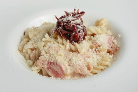 Close up of pasta with salmon and onion marmalade
