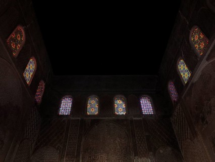 Colourful mosaic windows in the dark