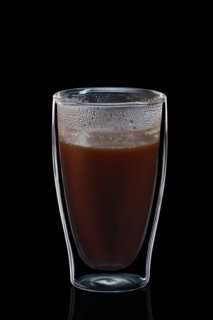 Double-walled glass with coffee isolated on black. Photo with clipping path
