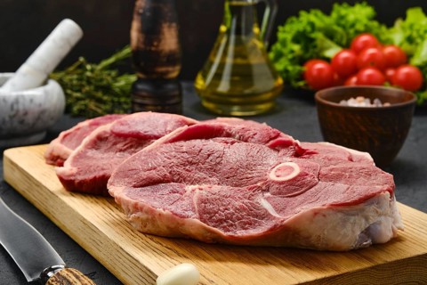 Close up view of lamb steaks with spice