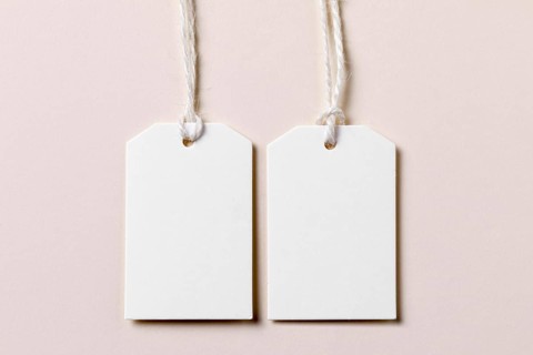 Top view empty labels arrangement beige background. Resolution and high quality beautiful photo
