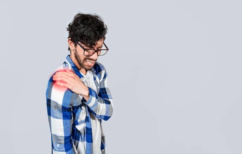 Man with upper arm muscle pain