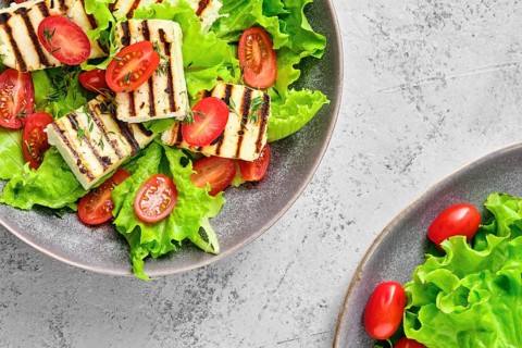 Top view of salad with grilled cheese