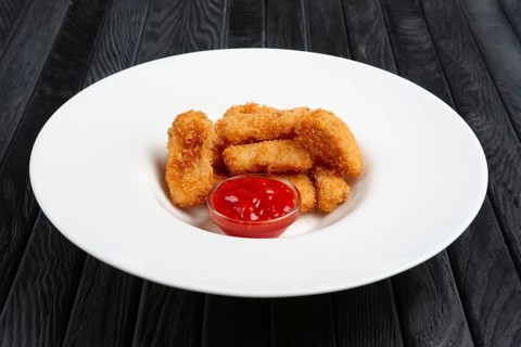 Deep fried chicken nuggets on a plate