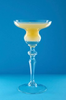 Old Cuban cocktail on blue background