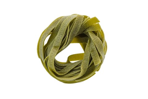 Top view of nest noodles isolated on white background. Italian tagliatelle with spinach